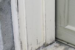 Garage door frame before repairs and exterior painting in Ottawa